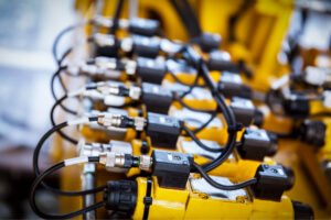 A bank of hydraulic solenoid valves on a machine
