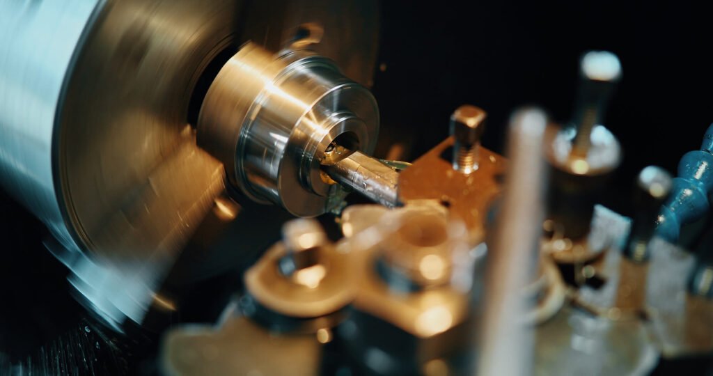 A CNC lathe boring a steel workpiece